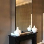 stalen spiegel boven schouw boven haard